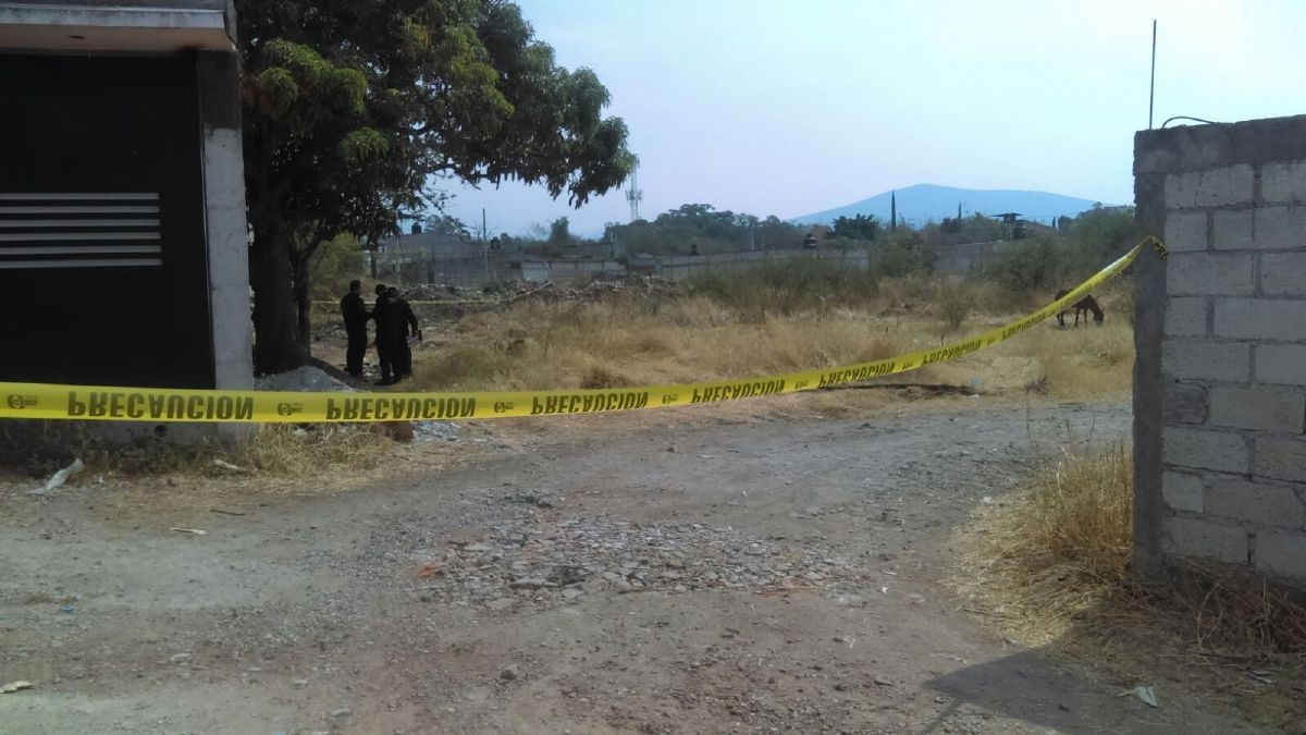 Hallan un cadáver en un terreno baldío